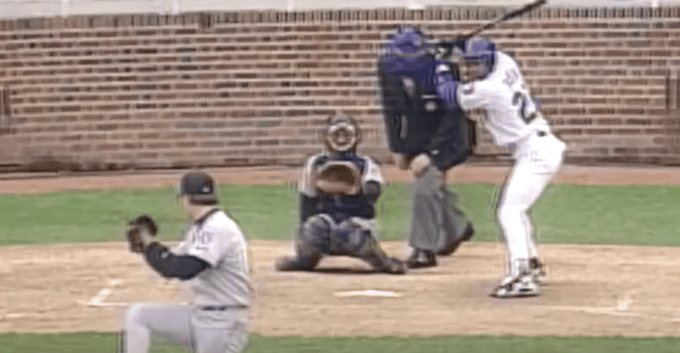 Sammy Sosa hits a home run, showcasing his legacy in Cubs history.